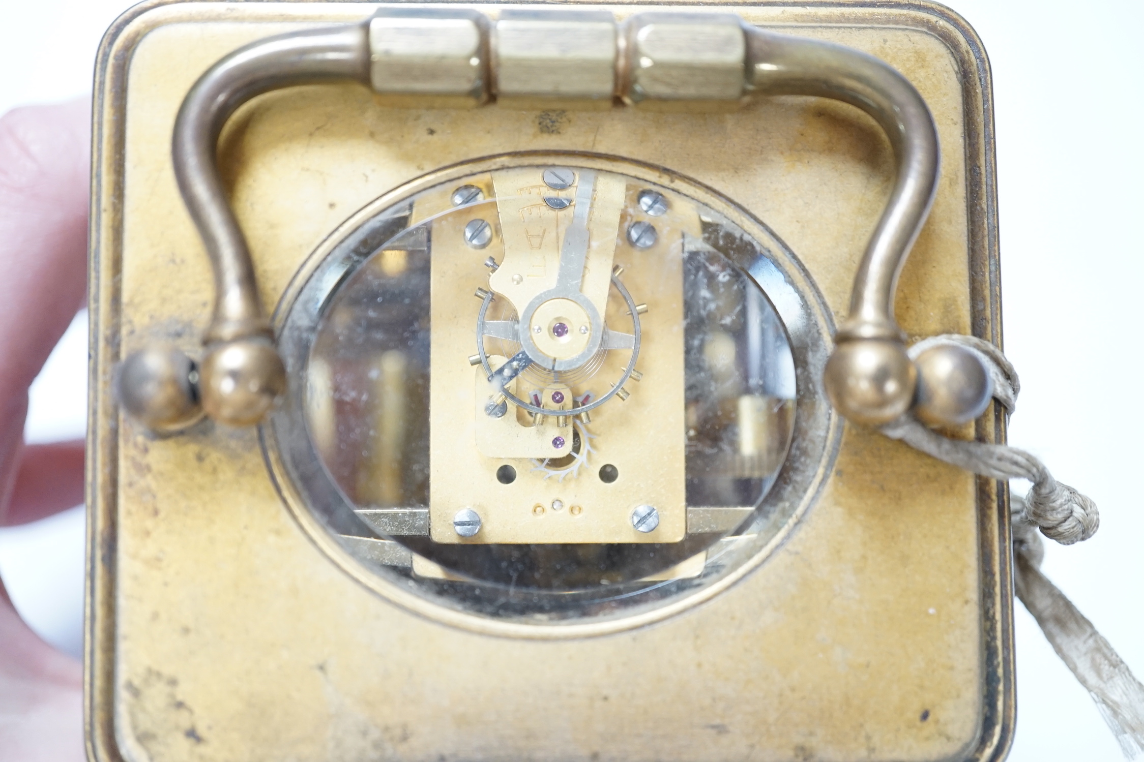 A brass carriage clock with subsidiary dial, 16cm high